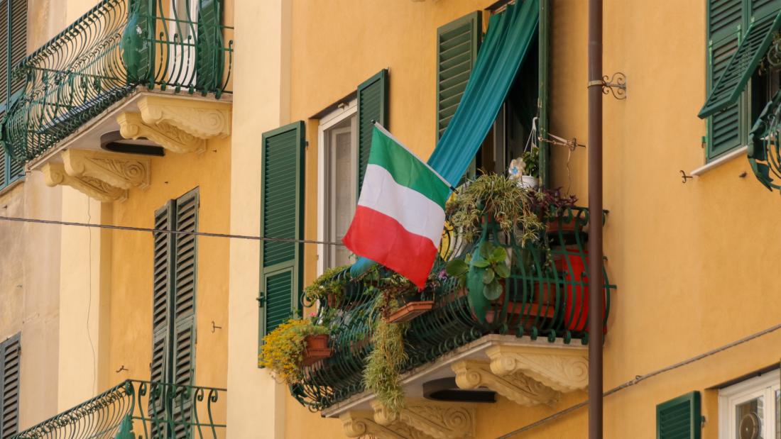 Italian flag hanging from balcony 