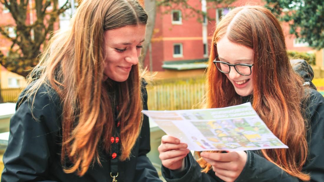 Two young people looking at a map