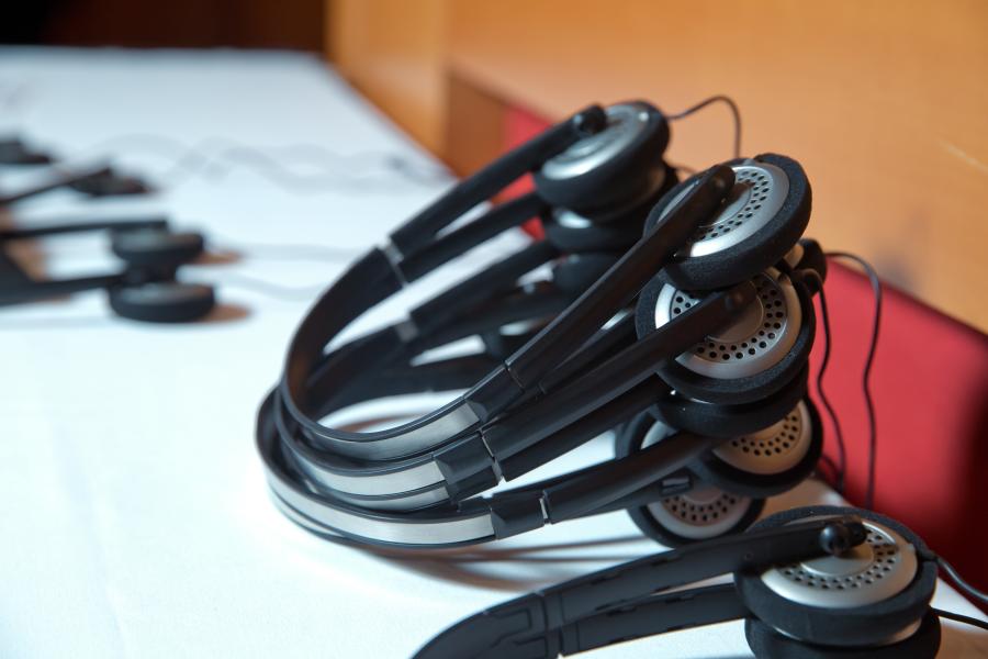Translation headsets on a boardroom table