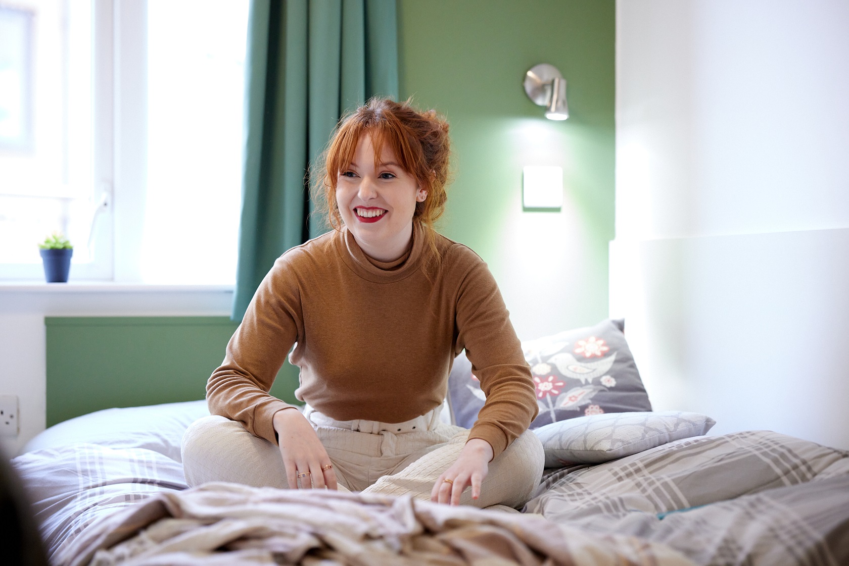 Student Holly Shone in a bedroom in St Mary's accommodation