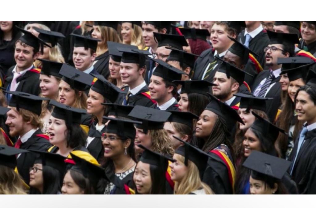 Students in their caps and gowns in the Graduation ceremony.