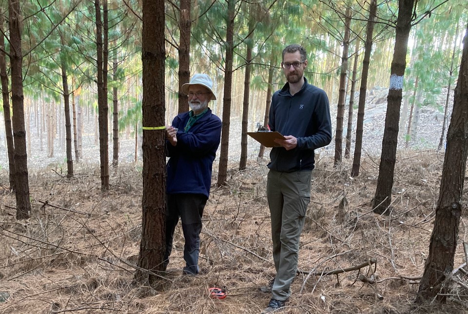 Prof. Julian Evans and his son in woodland