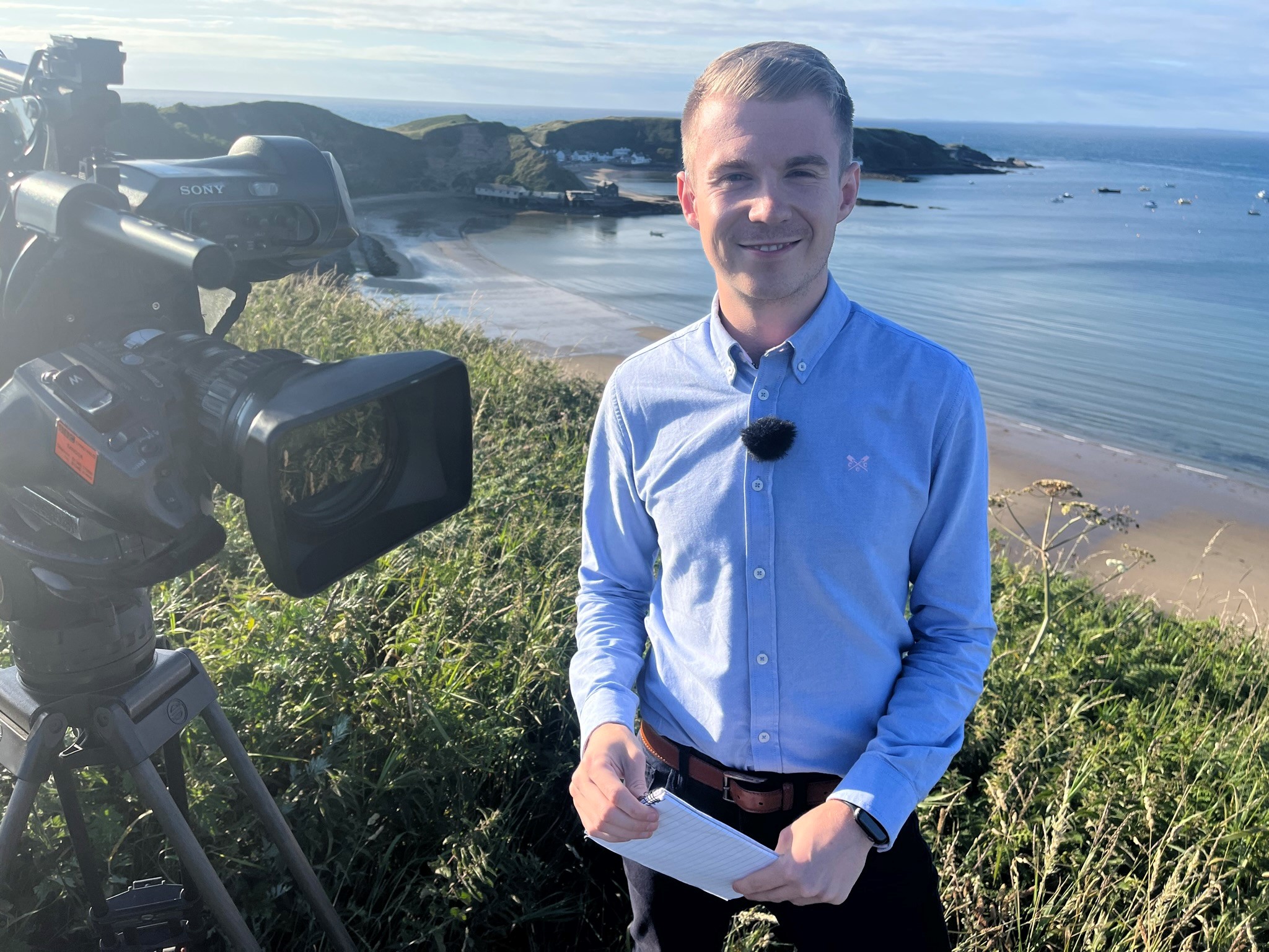 Liam Smiling to Camera with beach backdrop