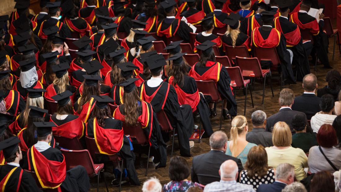 Students in PJ Hall during graduation ceremony