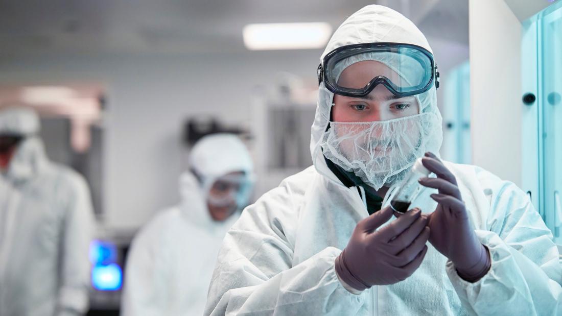 Students wearing protective equipment working in a lab