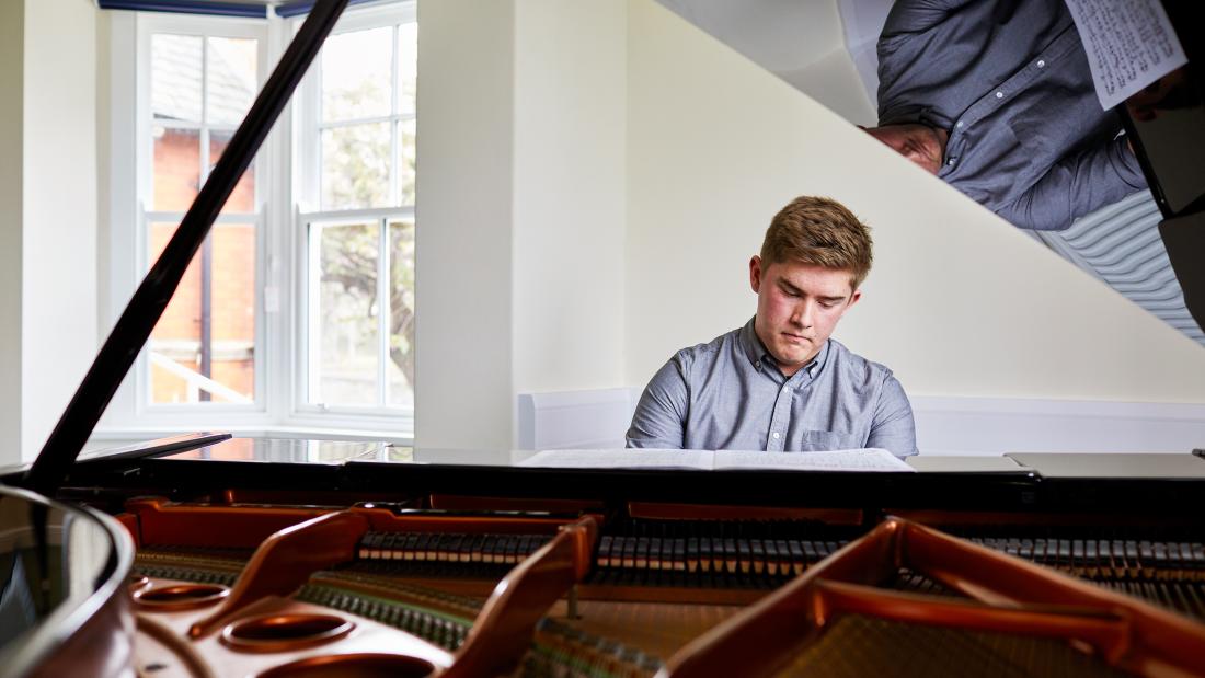 Student playing the piano