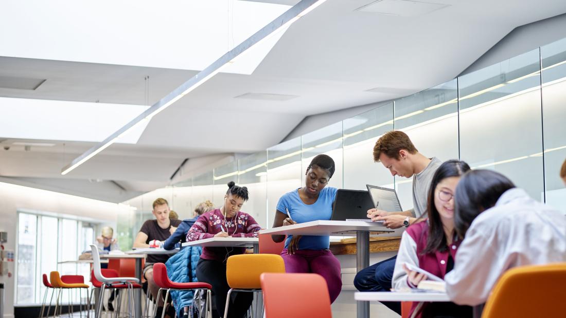 A group of students using the social learning spaces in Pontio