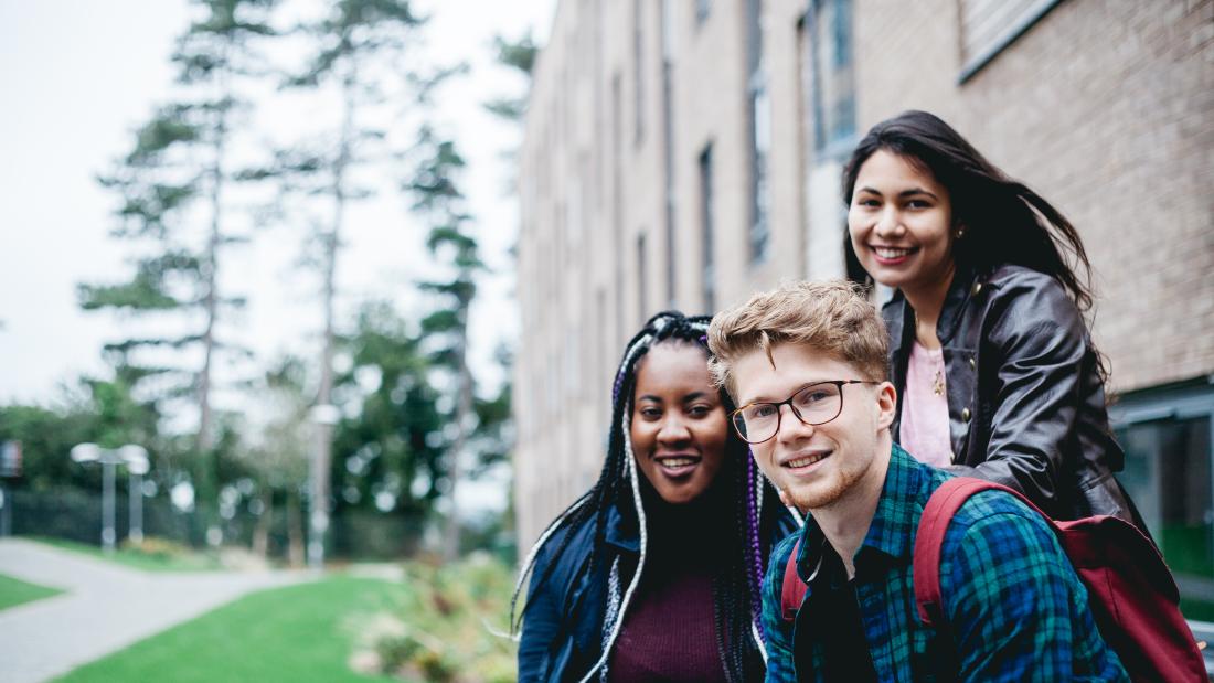 Students socialising outside the halls of residence at St Mary's Student Village