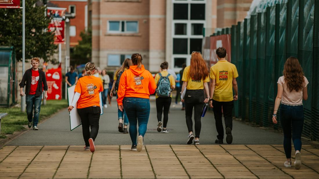Peer Guides walking through the Ffriddoedd Student Village during Welcome Week