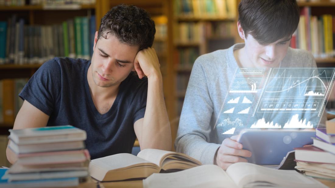 Students working together with futuristic interface in the library