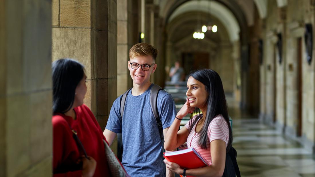 Groups of student talking on Main Arts corridor