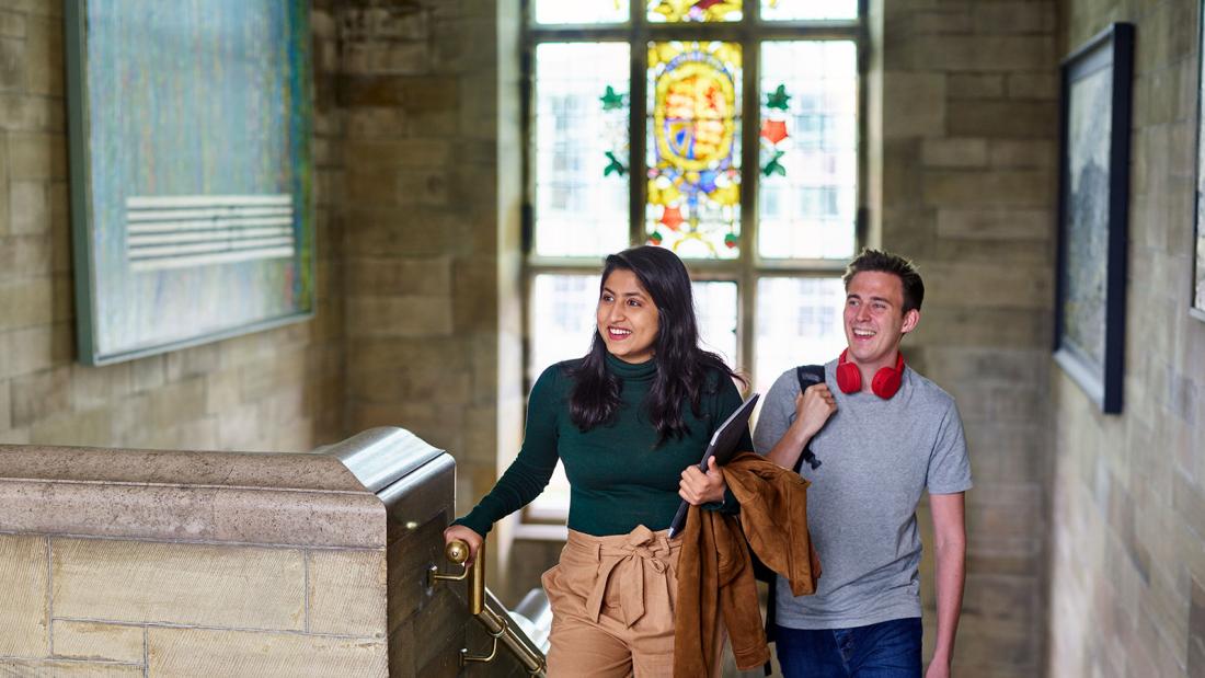 Students coming up stairs in Main Arts building