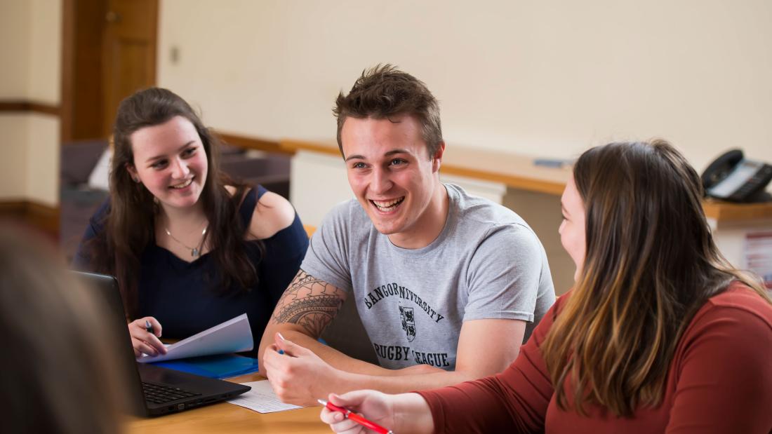 Students sharing a joke during a seminar