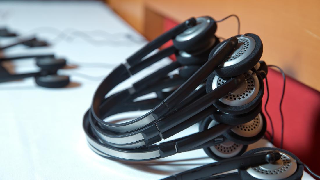 Translation headsets on a boardroom table