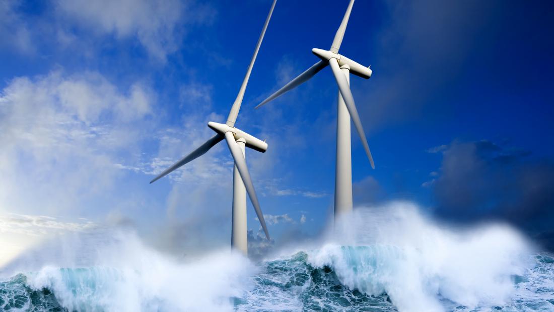 Wind turbines generating green energy at sea.