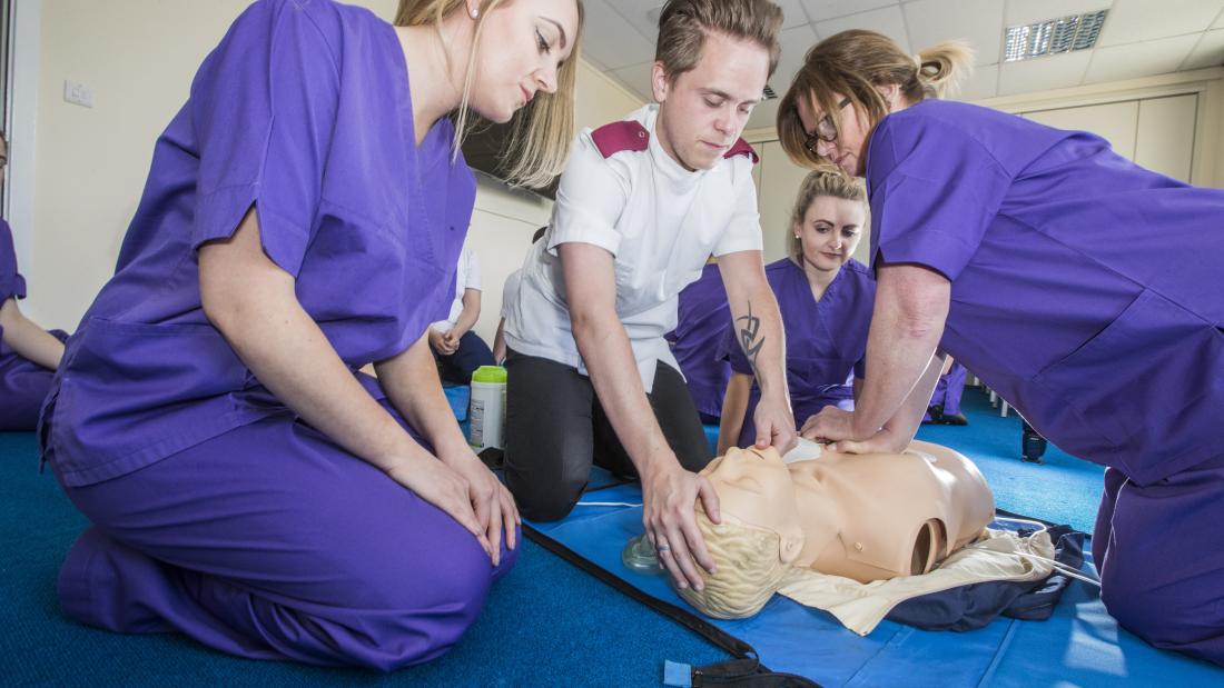 Student nurses learning how to give CPR