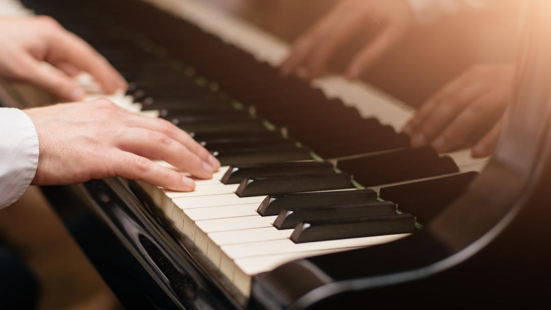 Close-up of a piano being played