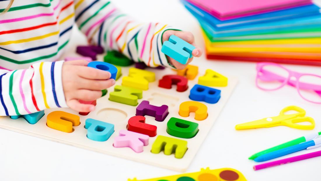 Child playing with learning resources