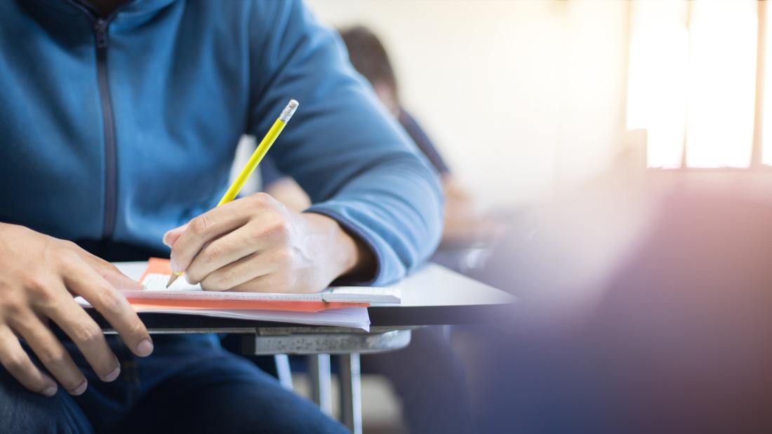 Photo of person writing notes