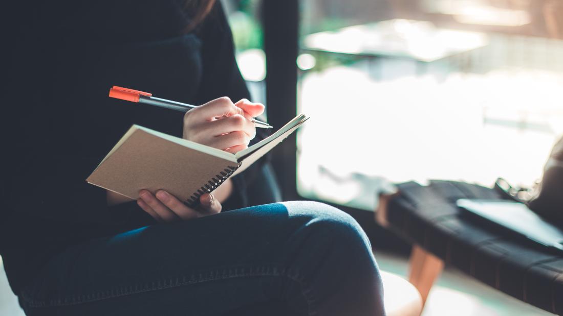 Woman writing in journal