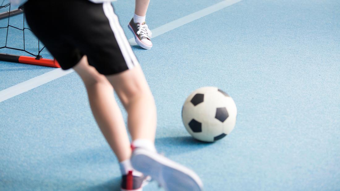 Pupils playing football