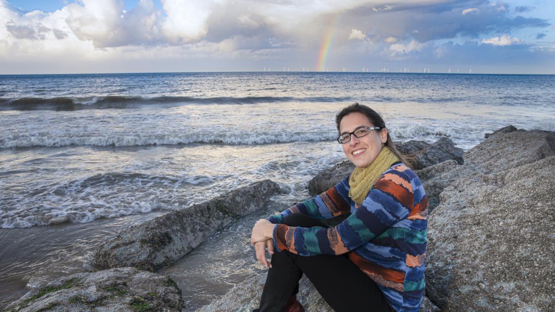 Person with sea in the background