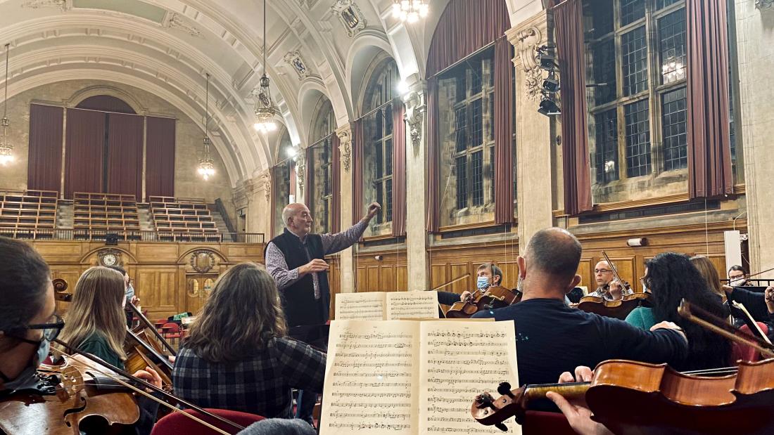 person conducting an orchestra