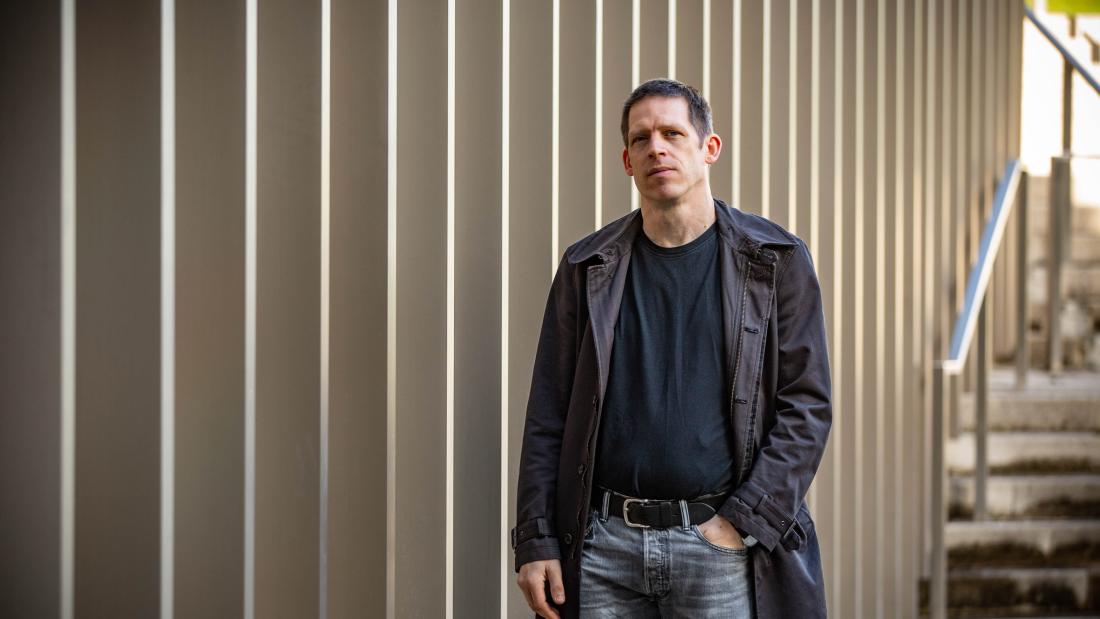 person standing outside a building