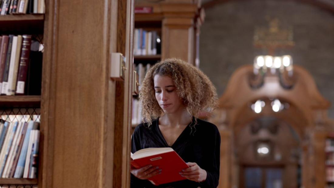 Student reading in the Shankland library