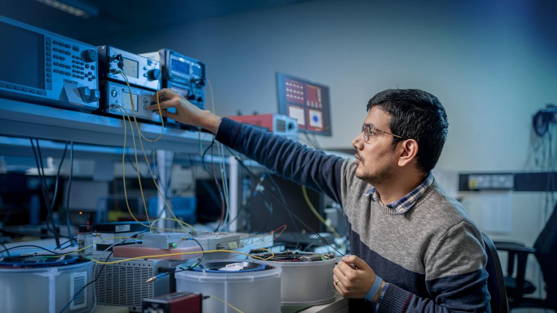 Researcher working on equipment at DSP Centre