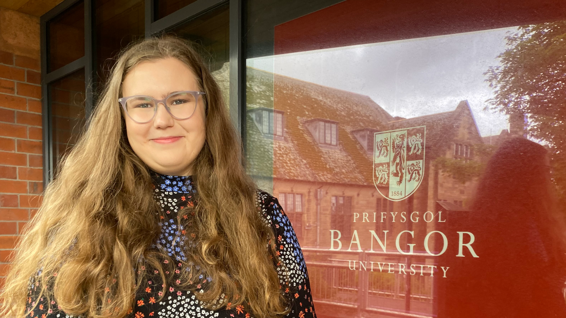 Charlotte is outside the music department in this picture