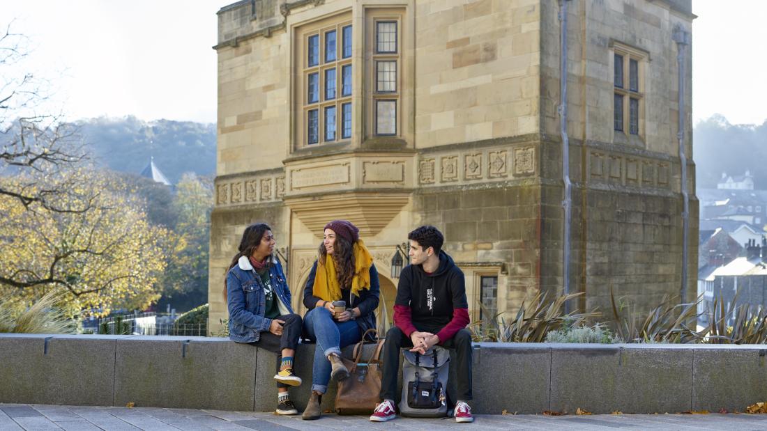 Students socialising outside Pontio