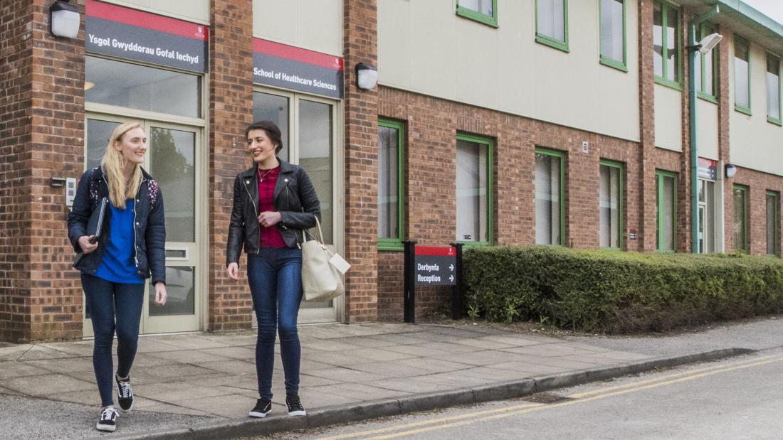 Students walking around Wrexham Campus