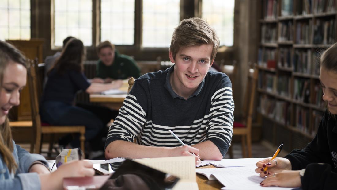 Group of students studying in library