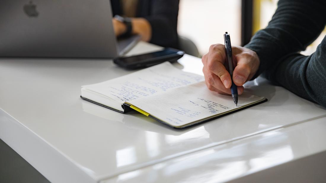 Lawyer writing in book