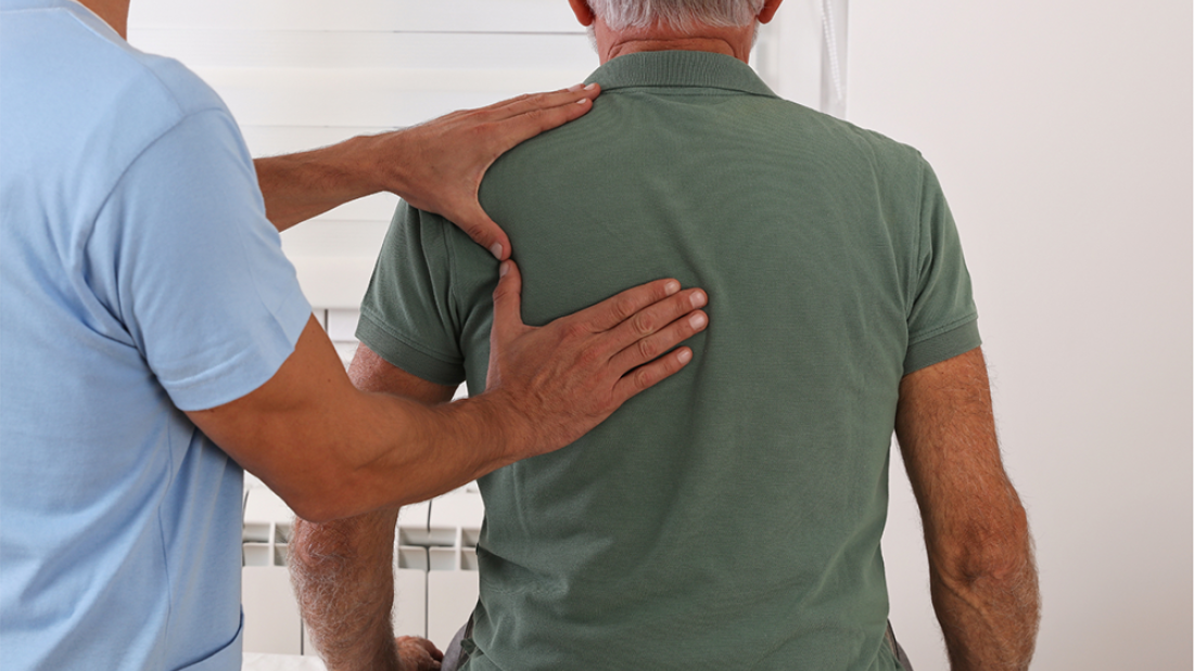 Man having physio on his back