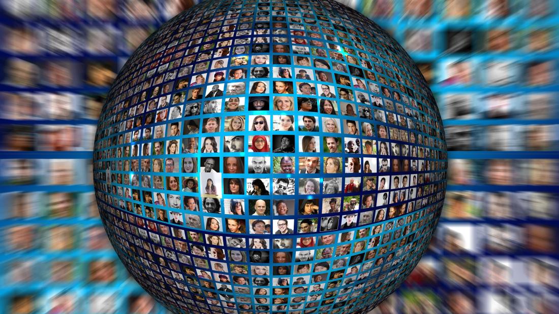 a globe made up of tiny images of people