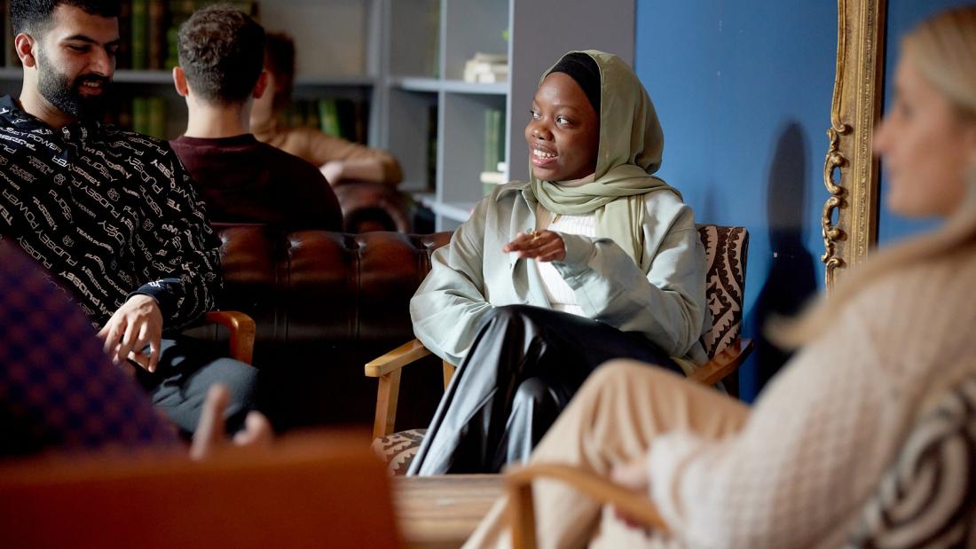 Students talking and relaxing in Barlows, St Mary's Student Village