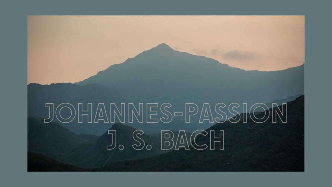 Words Johannes-Passion JS Bach on image of misty mountain