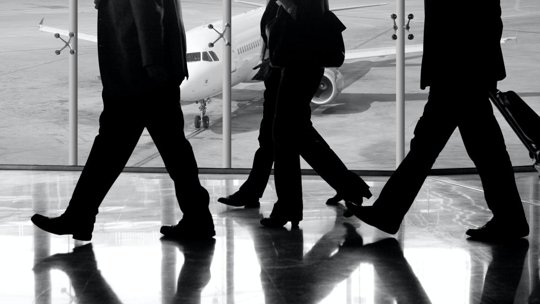 People walking in the airport to catch the plane 