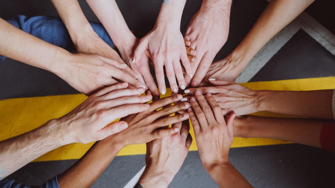 Multiple hands together