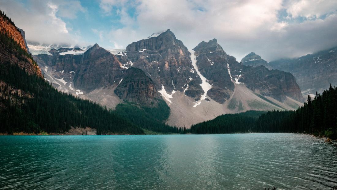 Image of body of water, forest and a mountain