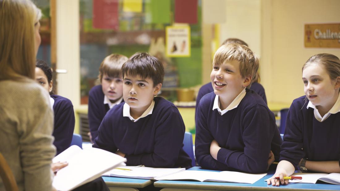 children listening to teacher