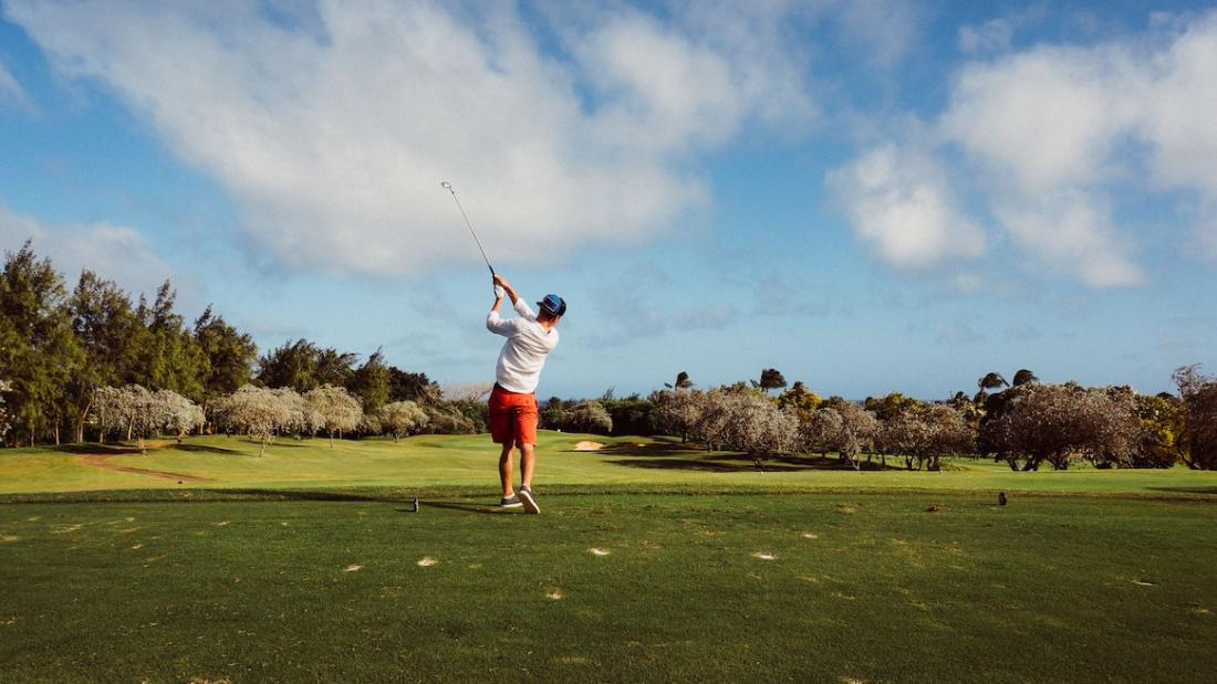 Man in White T Shirt Playing Golf