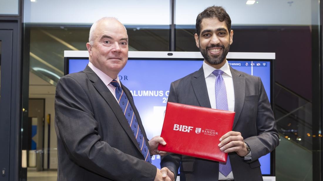 Hasan Sater receiving his award from Prof. Andrew Edwards