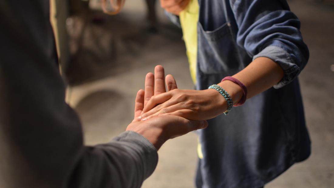 Hands holding signifying help