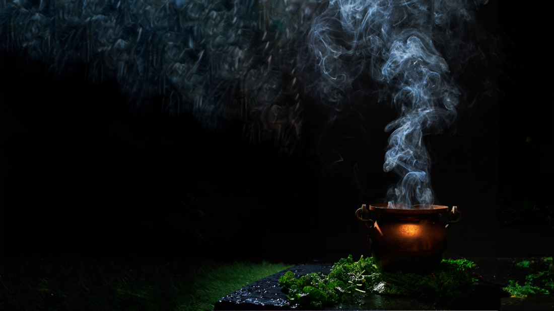 Cauldron with steam billowing out of it