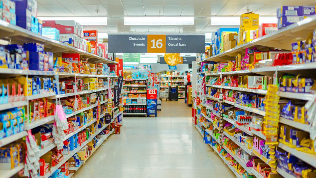 A supermarket aisle full of tinned products 