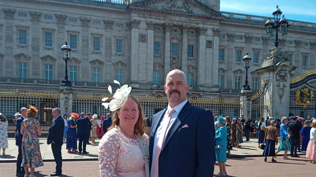 Graham French with his wife Julie in front of Buckingham Palace