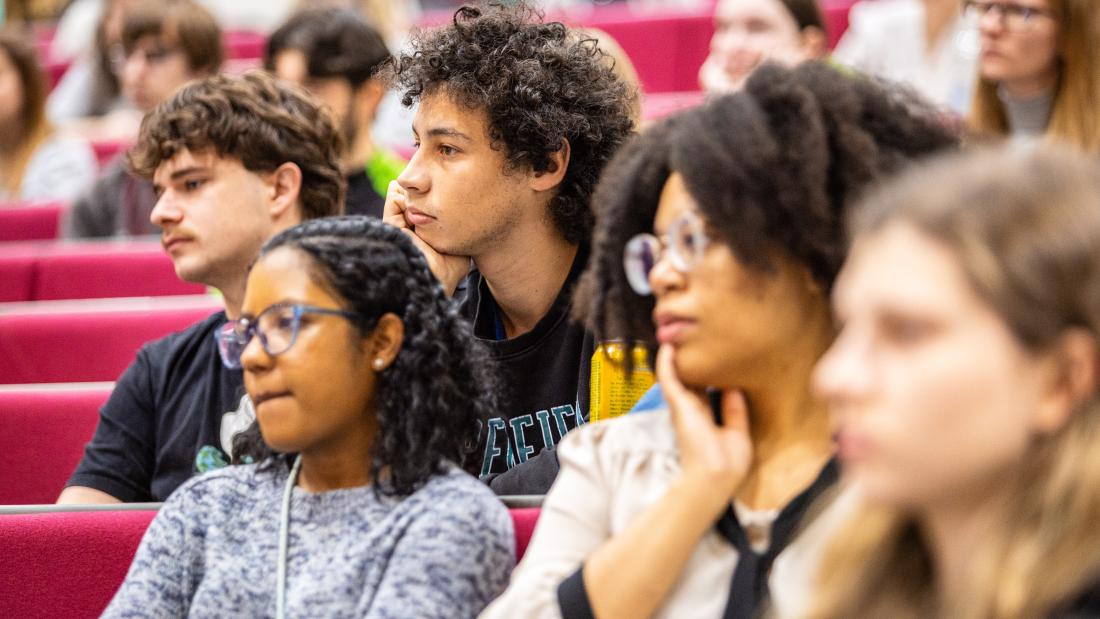Students in a lecture theatre watching a presentation from a guest speaker during the 2023 Bangor University Careers Fair, part of My Graduate Career Week